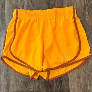 Orange Nike Women’s Dri fit running shorts. XS